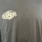 Black t-shirt with a logo on a mannequin against a plain background